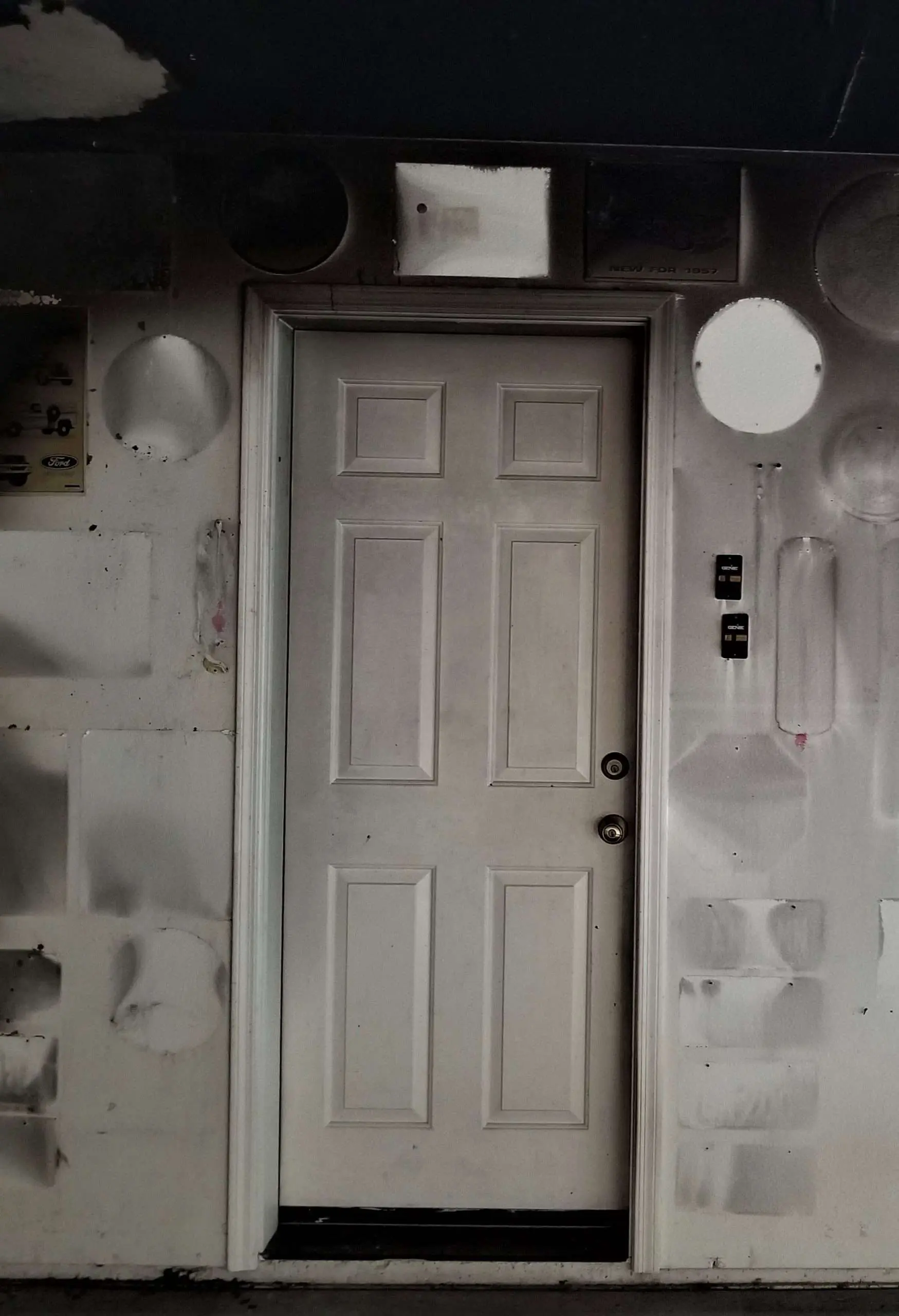 Soot-covered wall and door after a fire